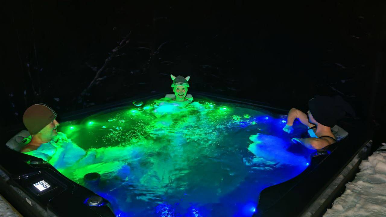 enjoying spa with friends in outdoor jacuzzi
